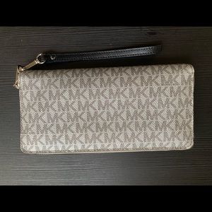 Silver Micheal Kors Wristlet wallet, barely used.